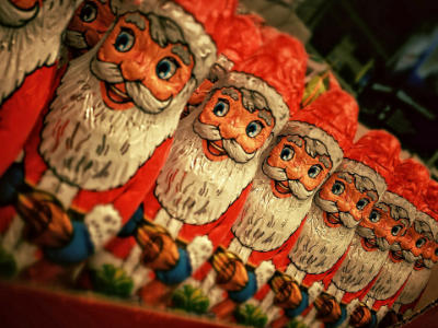 A row of chocolate Santa Clauses